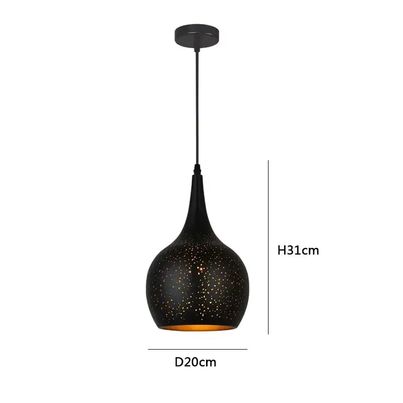 Black nordic industrial pendant light with speckled textured surface and amber gold interior for dining room decorbites