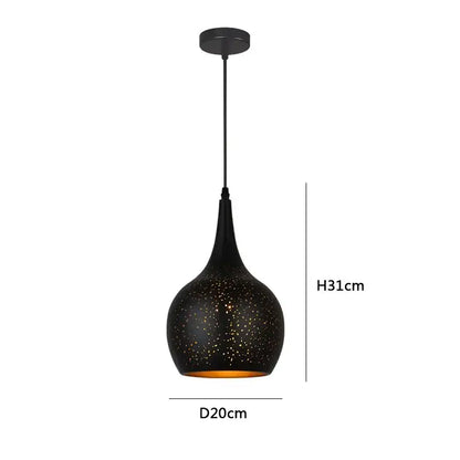 Black nordic industrial pendant light with speckled textured surface and amber gold interior for dining room decorbites