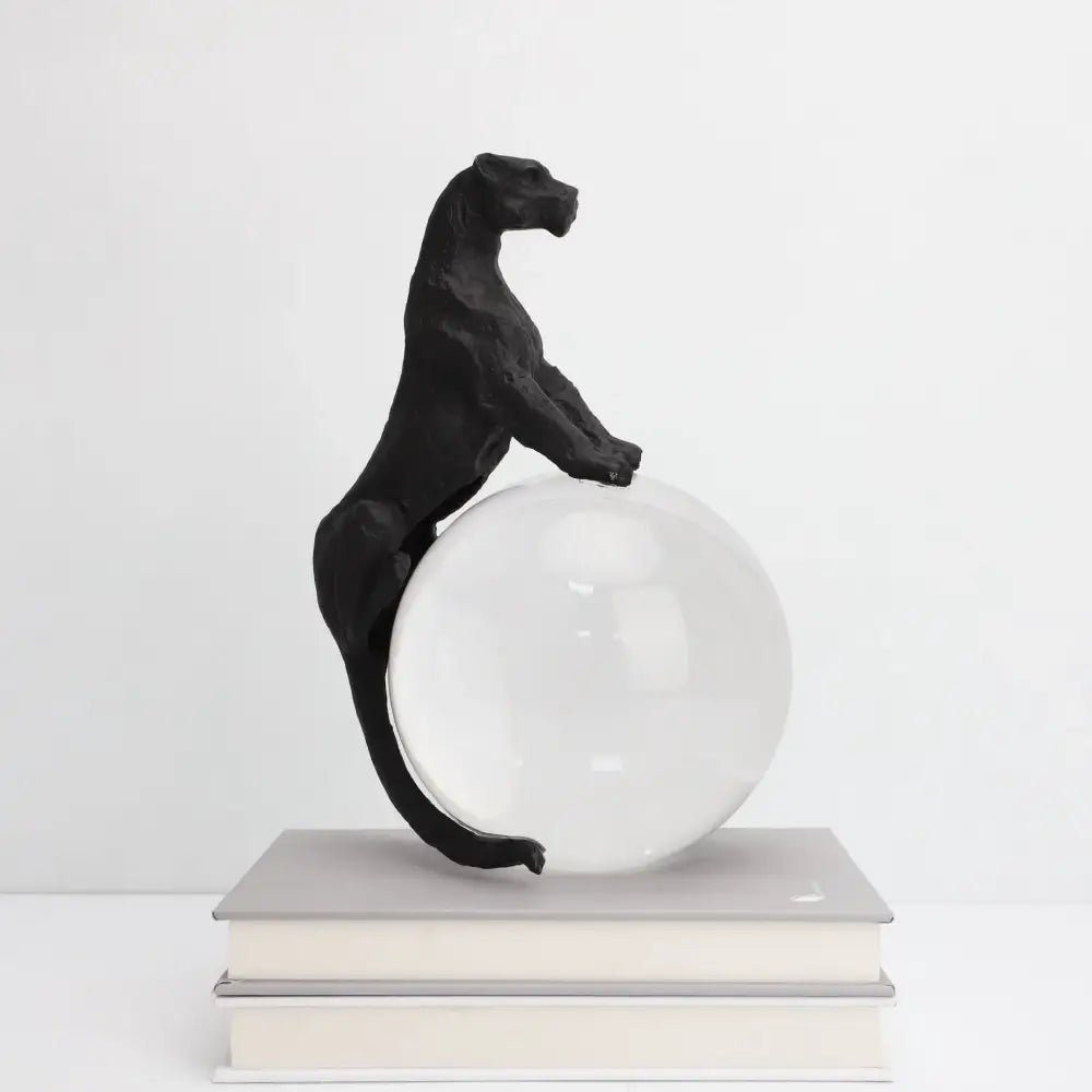 Black panther crystal ball metal animal sculpture standing atop a clear glass sphere for decorbites crystal ball decor