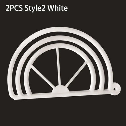White plastic cookie cutter with concentric arches and spokes used as decorbites hat brim bender accessory