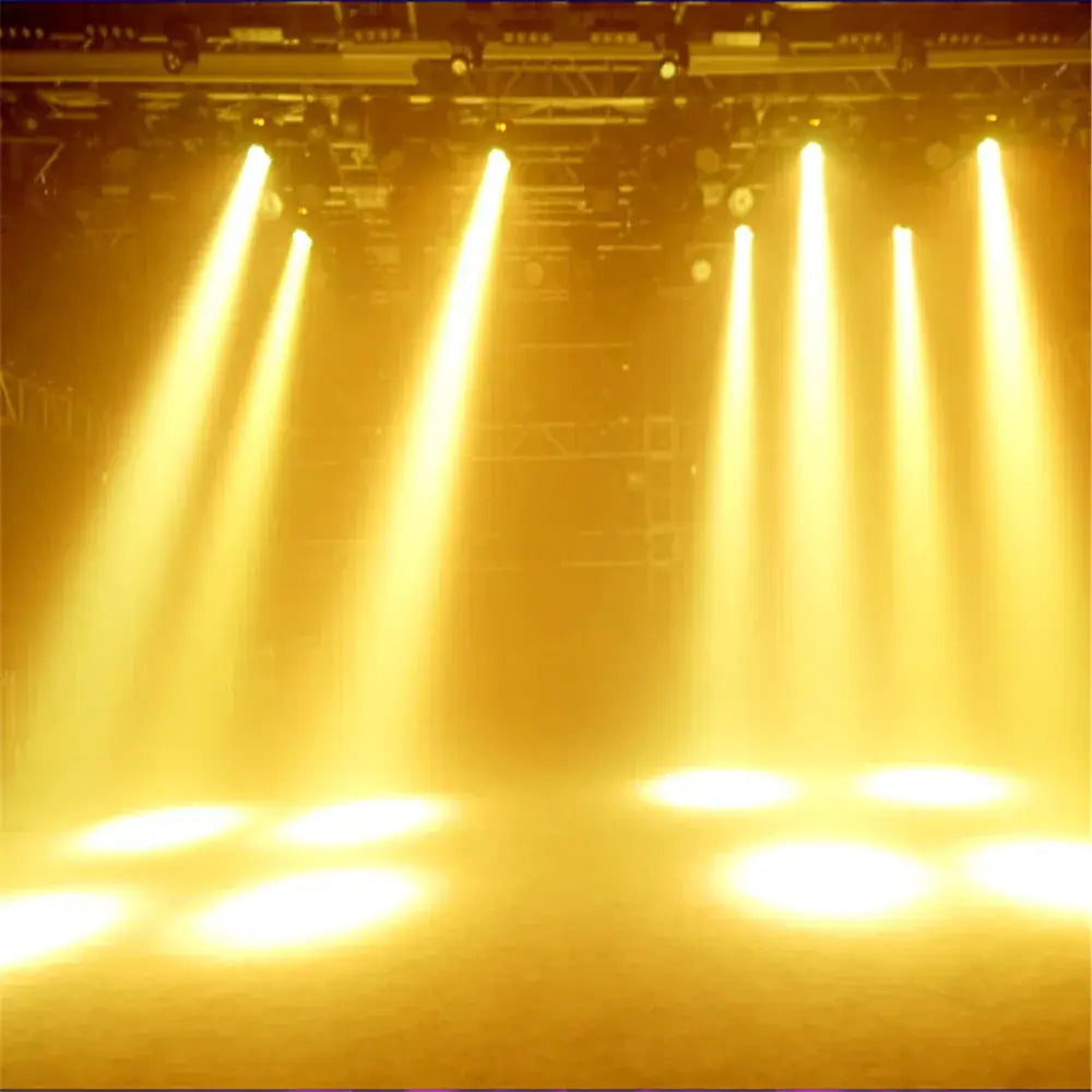 Golden beams from black and purple 4in1 quad 12x12w stage light illuminating the performance area