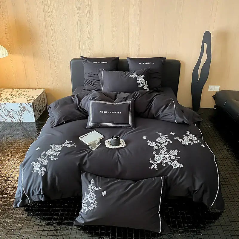 Black satin bedding set with white cotton flowers embroidery and piping details made from egyptian cotton for bedroom use