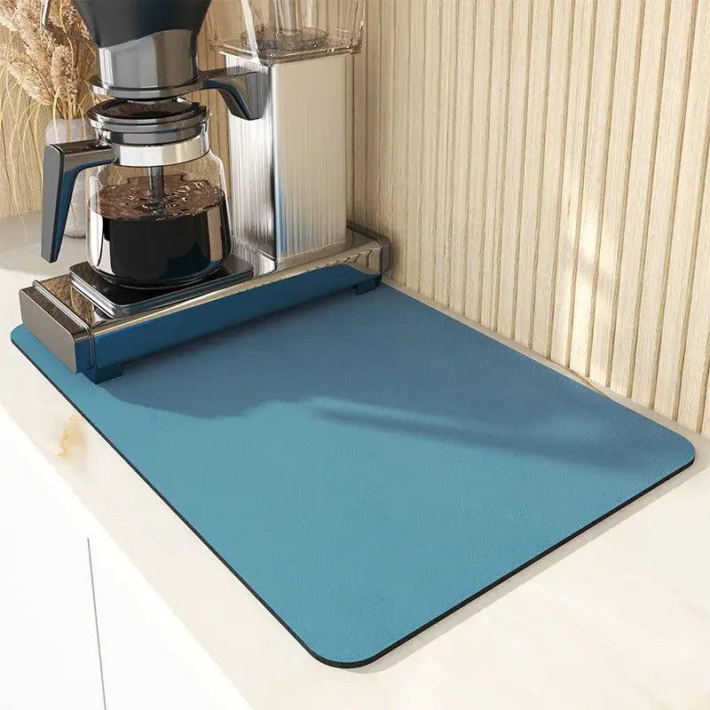 Blue rectangular silicone decorbites espresso machine mat with black border for absorbent coffee kitchen use