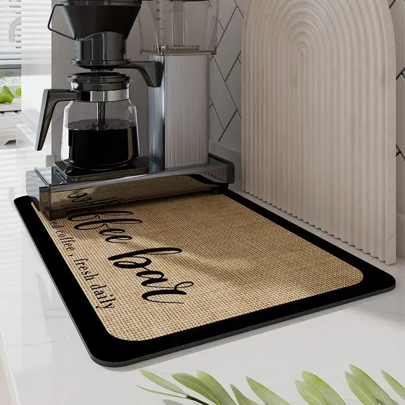 Black silicone absorbent espresso machine mat with burlap texture and black coffee bar script for decorbites espresso use