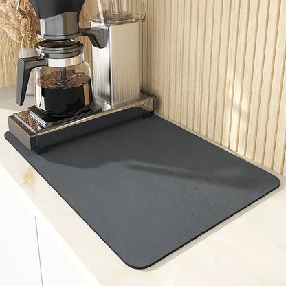 Dark gray black silicone absorbent decorbites espresso machine mat with a smooth, slightly textured non-slip surface