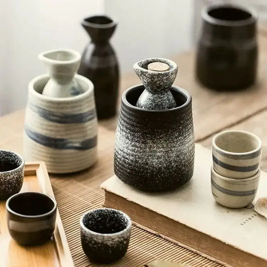 Black speckled ceramic wine sake set with heater featuring a cork-stoppered bottle nestled in its base decorbites ceramic wine