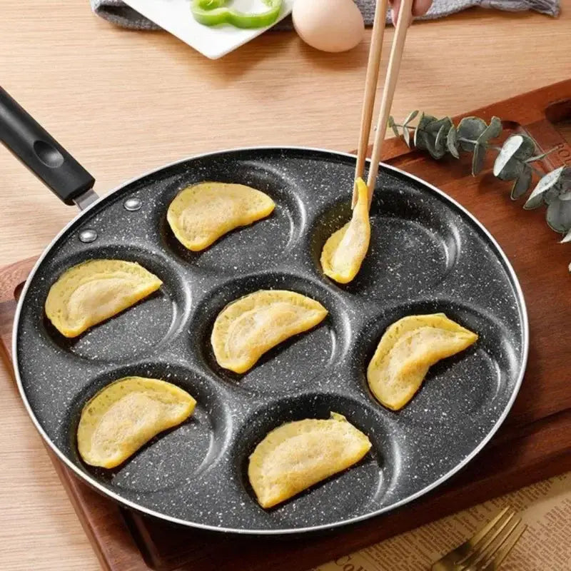Black speckled non-stick breakfast egg pan with seven semi-circular sections for decorbites breakfast egg cooking tool