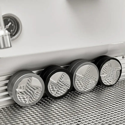 Four metallic decorbites espresso tamper knobs with black textured ridged edges and star-shaped cutouts for precise tamping