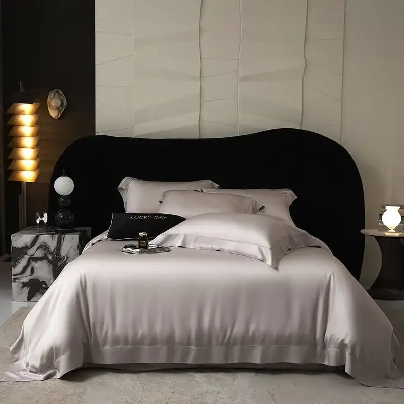 Silk satin duvet cover bedding set in soft light gray with elegant piping made from lyocell eucalyptus fiber