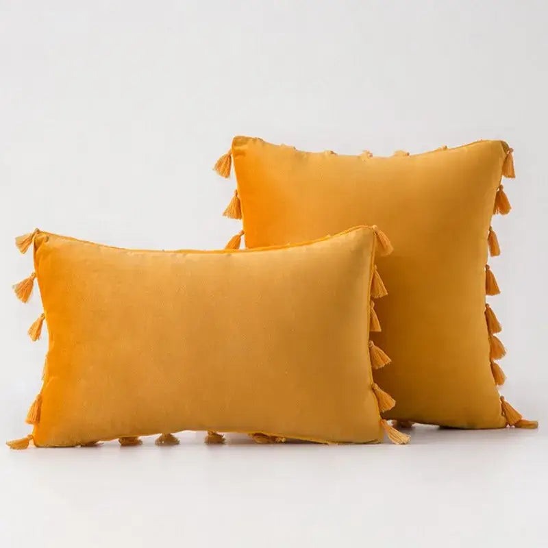 Warm mustard-yellow velvet pillow cover with decorative tassel fringe edges for decorbites black velvet collection