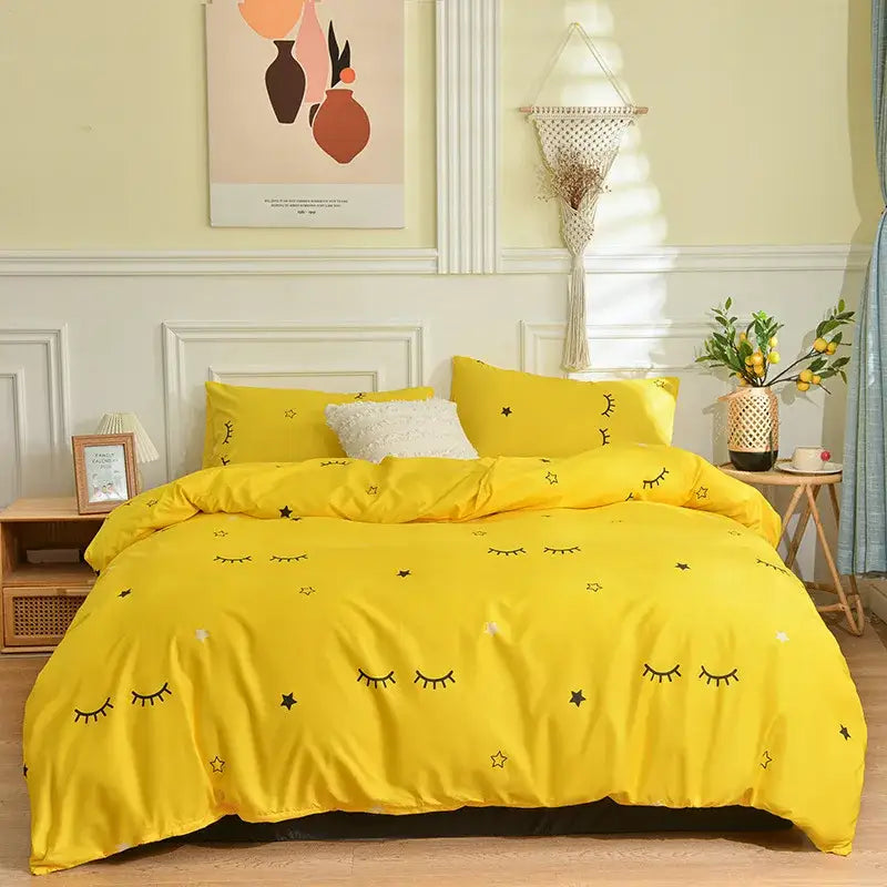 Bright yellow bedding set with playful black embroidered eyes and stars from decorbites branch flower duvet cover collection