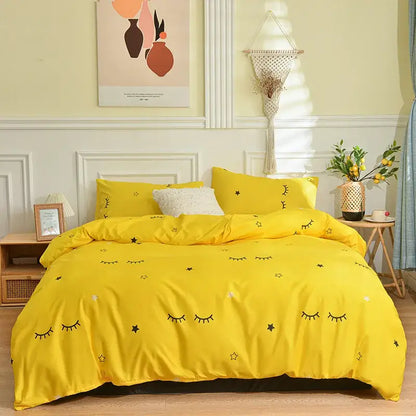 Bright yellow bedding set with playful black embroidered eyes and stars from decorbites branch flower duvet cover collection