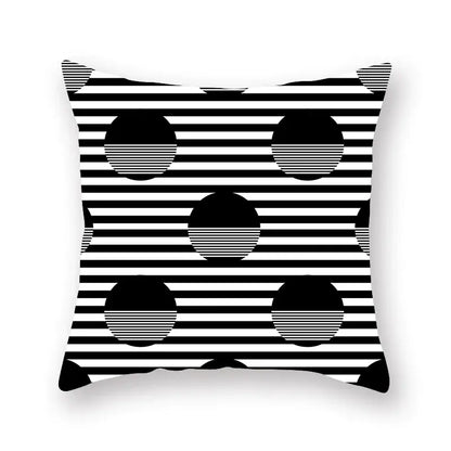 Black and white geometric star stripe throw pillow with bold stripes and solid circles for bedroom decor
