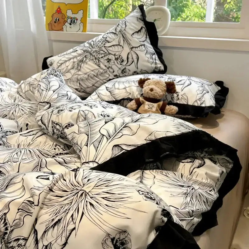 Black white printed floral bedding set with ruffled edges by decorbites for stylish bedroom linens and decorbites black white collection