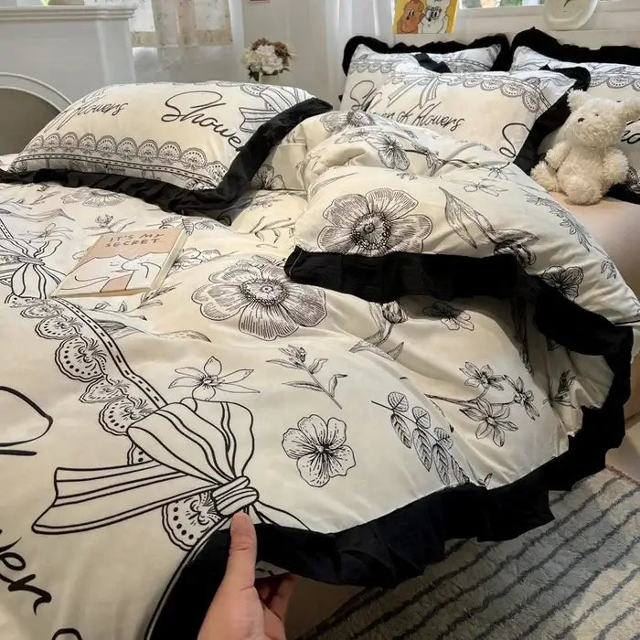 Cream-colored floral bedding set with black lace trim and embroidery from decorbites black white printed collection