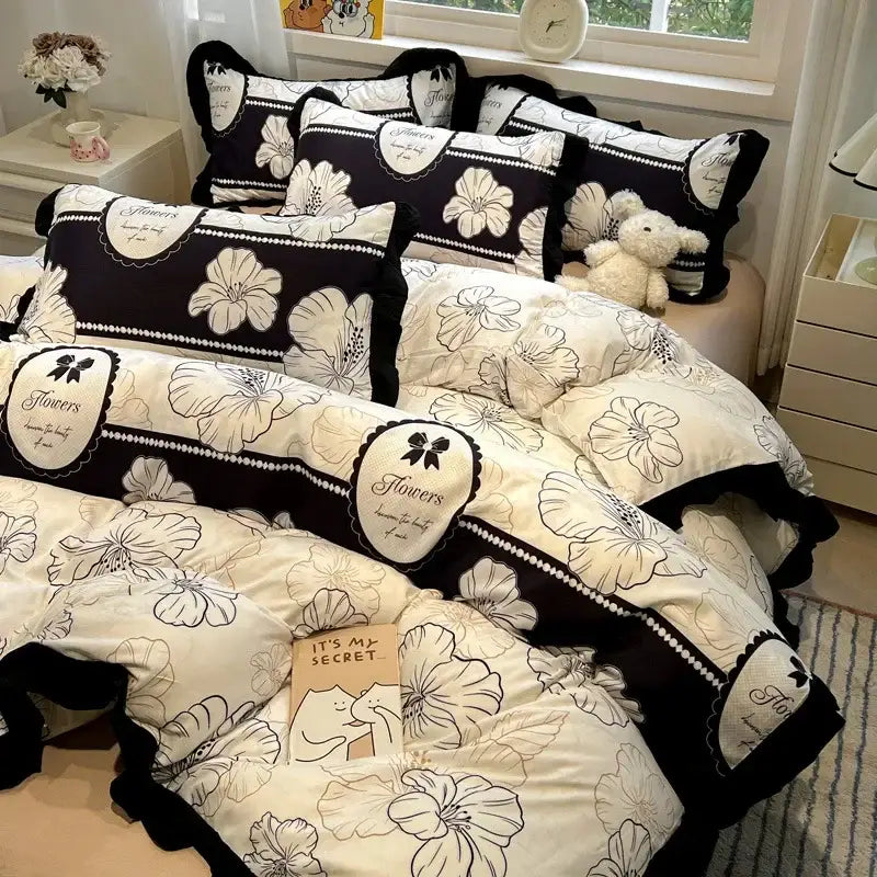 Black white printed floral ruffled bedding set with black and cream lace trim and embroidered flowers labels by decorbites black white