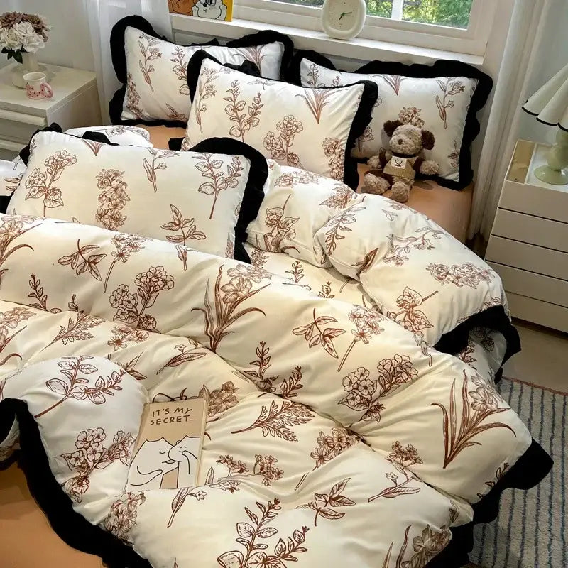 Cream-colored bedding set with brown botanical prints and black ruffled edges from decorbites black white printed collection