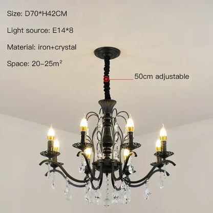 Black wrought iron chandelier with crystal droplets and candle style lights for dining room lighting