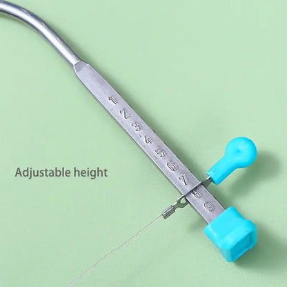 Silver metal adjustable height wire cutter with turquoise handles for decorbites cake slicer baking tool use
