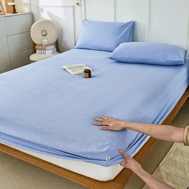 Light blue soft-textured fitted sheet with subtle woven pattern made of decorbites coarse cotton queen material