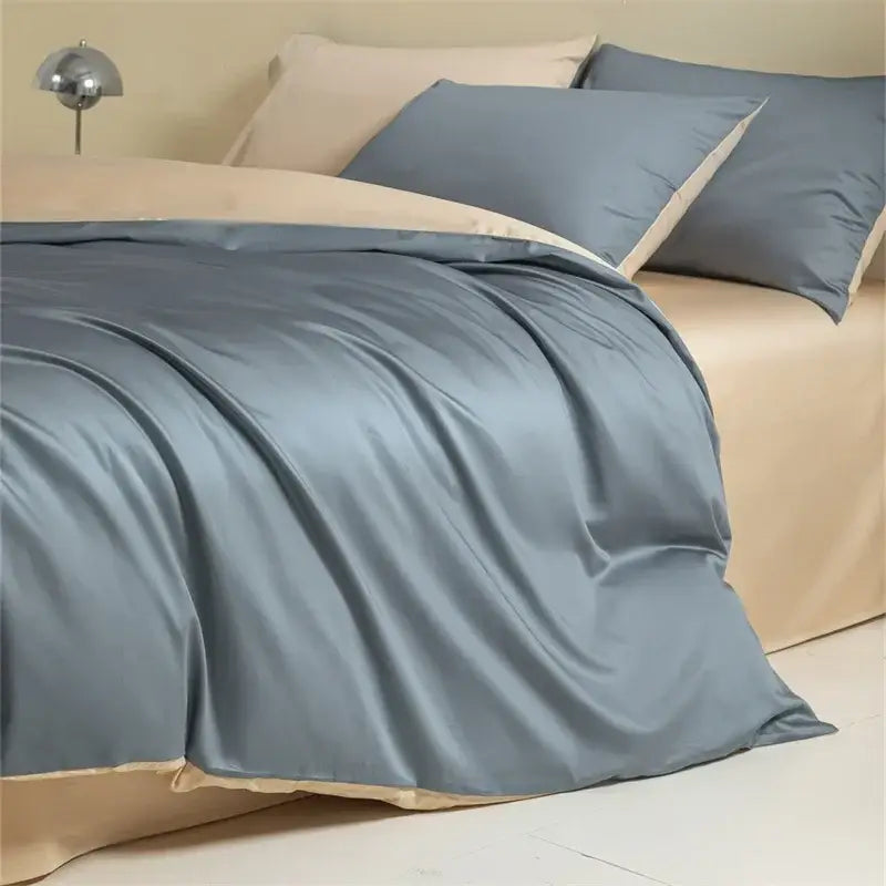 Blue and beige egyptian cotton bedding set featuring a silk-like blue duvet cover with cream piping edges