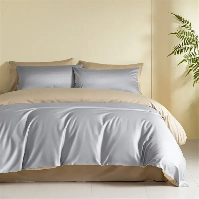 Silk-like gray duvet cover with matching beige pillowcases in a satin finish egyptian cotton bedding set for bedroom