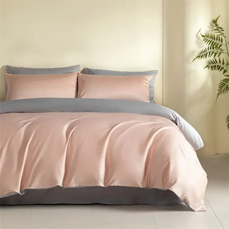 Blue and beige egyptian cotton bedding set with soft blush pink satin duvet cover and gray accent elegantly draped on bed