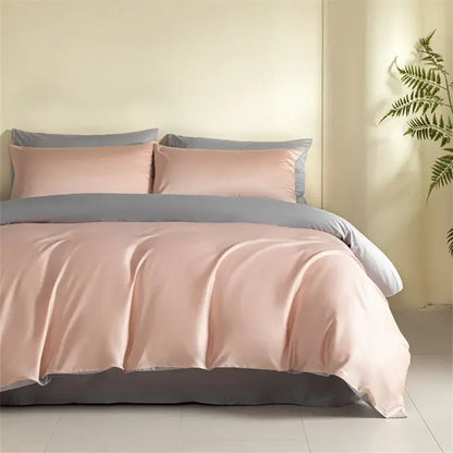 Blue and beige egyptian cotton bedding set with soft blush pink satin duvet cover and gray accent elegantly draped on bed