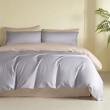 Lavender satin duvet cover with matching pillowcases and beige bed skirt in a blue and beige egyptian cotton bedding set