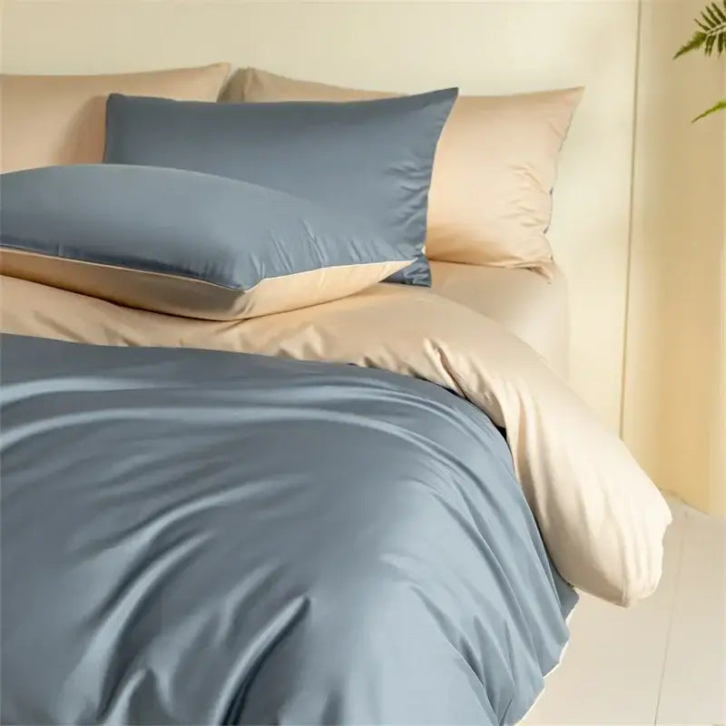 Soft blue satin egyptian cotton bedding set with subtle sheen paired with beige pillowcases for elegant bedroom