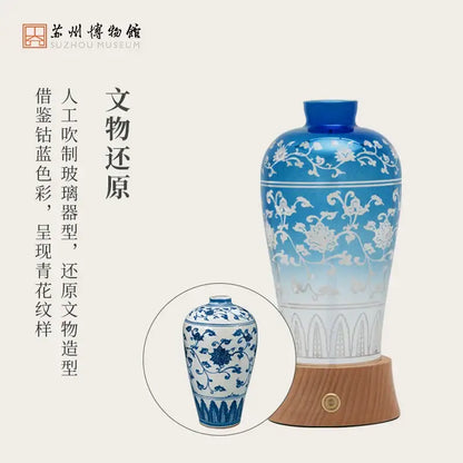 A tall slender blue and white glass liuguang qingying vase night light with intricate floral patterns for decorbites bedroom decor
