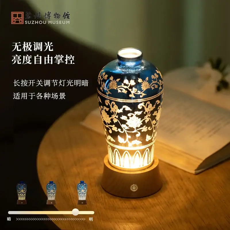 Blue and gold ceramic night light liuguang qingying vase with intricate floral patterns and warm internal illumination
