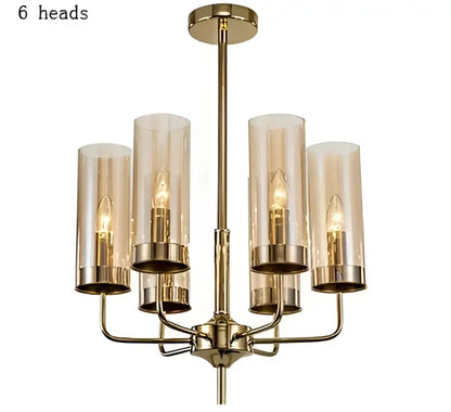 Blue and gold decorbites glass chandelier with six cylindrical glass shades and exposed filament bulbs for kitchen island lighting