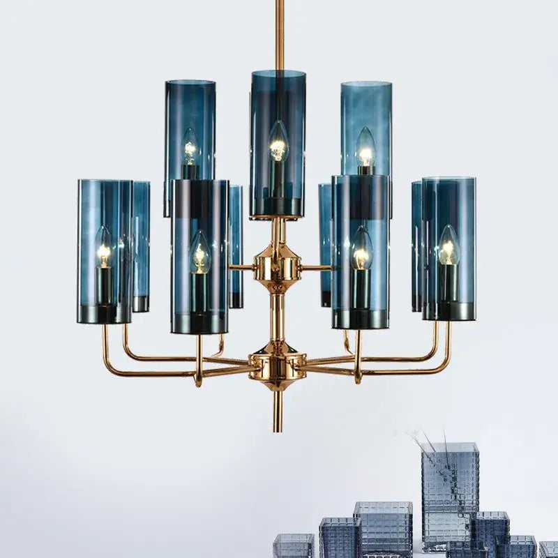 Blue and gold decorbites glass chandelier with brass accents and lit bulbs for kitchen island lighting