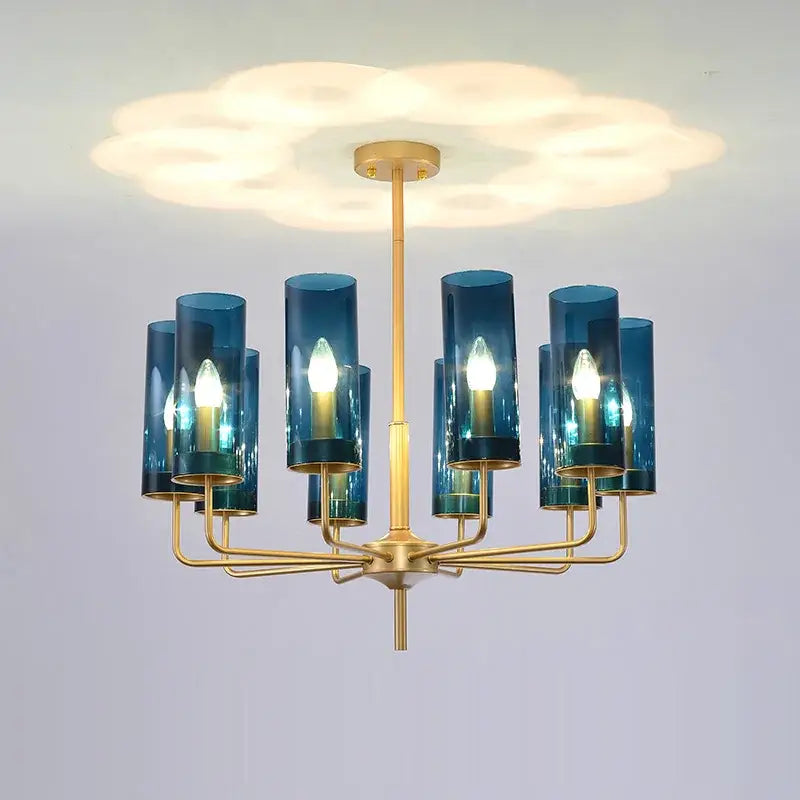 Blue and gold decorbites glass chandelier with blue glass cylinders and gold-toned metal for kitchen island lighting