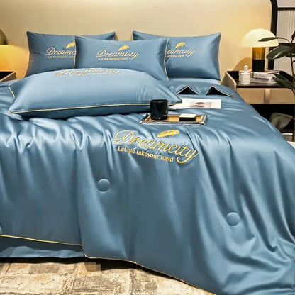 Blue satin quilt set with gold embroidered feather and dreamcity design made of ice silk summer fabric