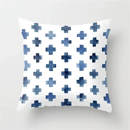 White throw pillow with blue watercolor crosses featuring decorbites geometric heart round pattern for living room decor