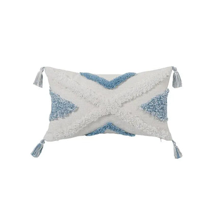A rectangular pillowcase set with a white base blue geometric tufted pattern and tassels for bedroom decorbites blue geometric decor