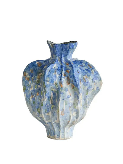 A textured blue and white irregular porcelain tulip vase with fluted organic shape for living room decorbites decor