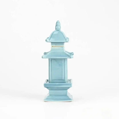 A delicate light blue porcelain layered pagoda lantern with a glossy finish for living room decor