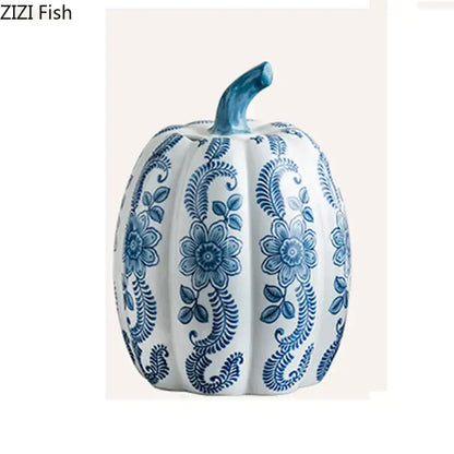 A white porcelain pumpkin vase with intricate blue white porcelain floral patterns and a matching blue stem for decor