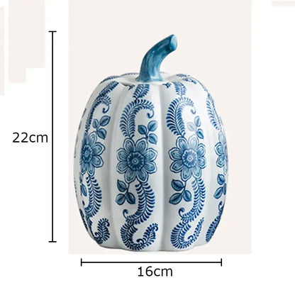 A white porcelain pumpkin vase with blue white porcelain intricate floral patterns and a matching blue stem for living room decor