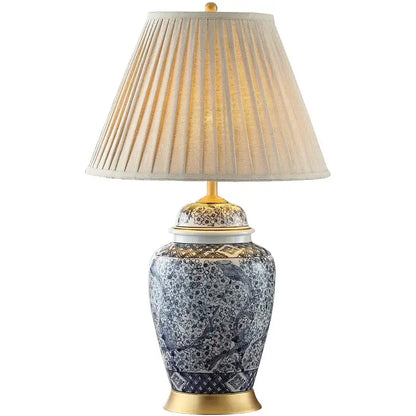 Blue and white porcelain table lamp with gold accents and intricate bird floral patterns by decorbites blue porcelain decor