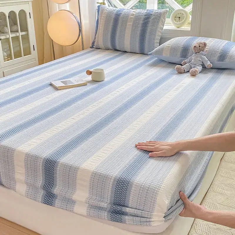 Blue and white striped cotton jacquard fitted sheet set with textured woven pattern for bedroom use
