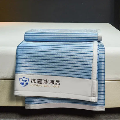 Blue and white striped decorbites ice silky cooling mat with stitched border for bedroom use