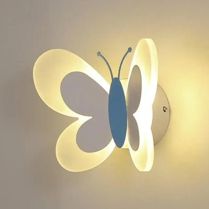 A blue butterfly girl cartoon children room lamp with translucent wings emitting a soft white and blue glow