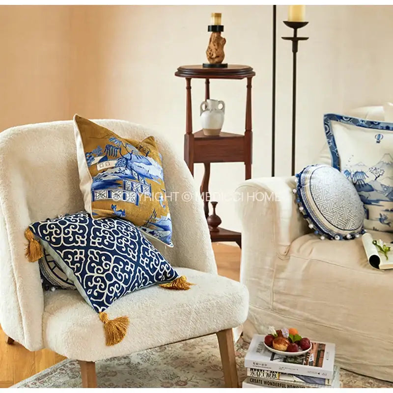 Blue chinoiserie home pagoda bolster pillowcase featuring a blue and white patterned throw pillow with gold tassels