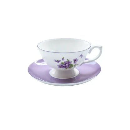 A delicate white porcelain tea set with lavender floral pattern and subtle purple accents from the blue dream tea collection