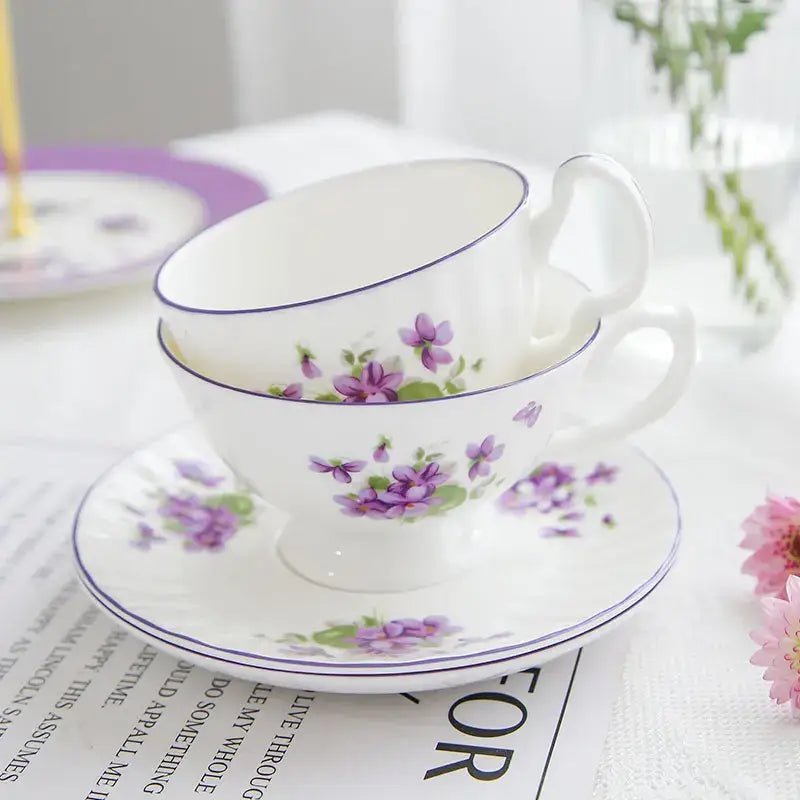 White porcelain tea set with delicate purple floral patterns and blue rim from the blue dream tea collection