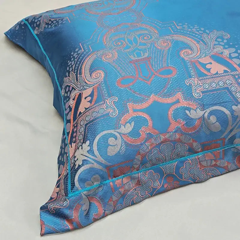 A luxurious blue satin jacquard pillow sham with coral silver and teal paisley floral pattern in decorbites duvet cover set